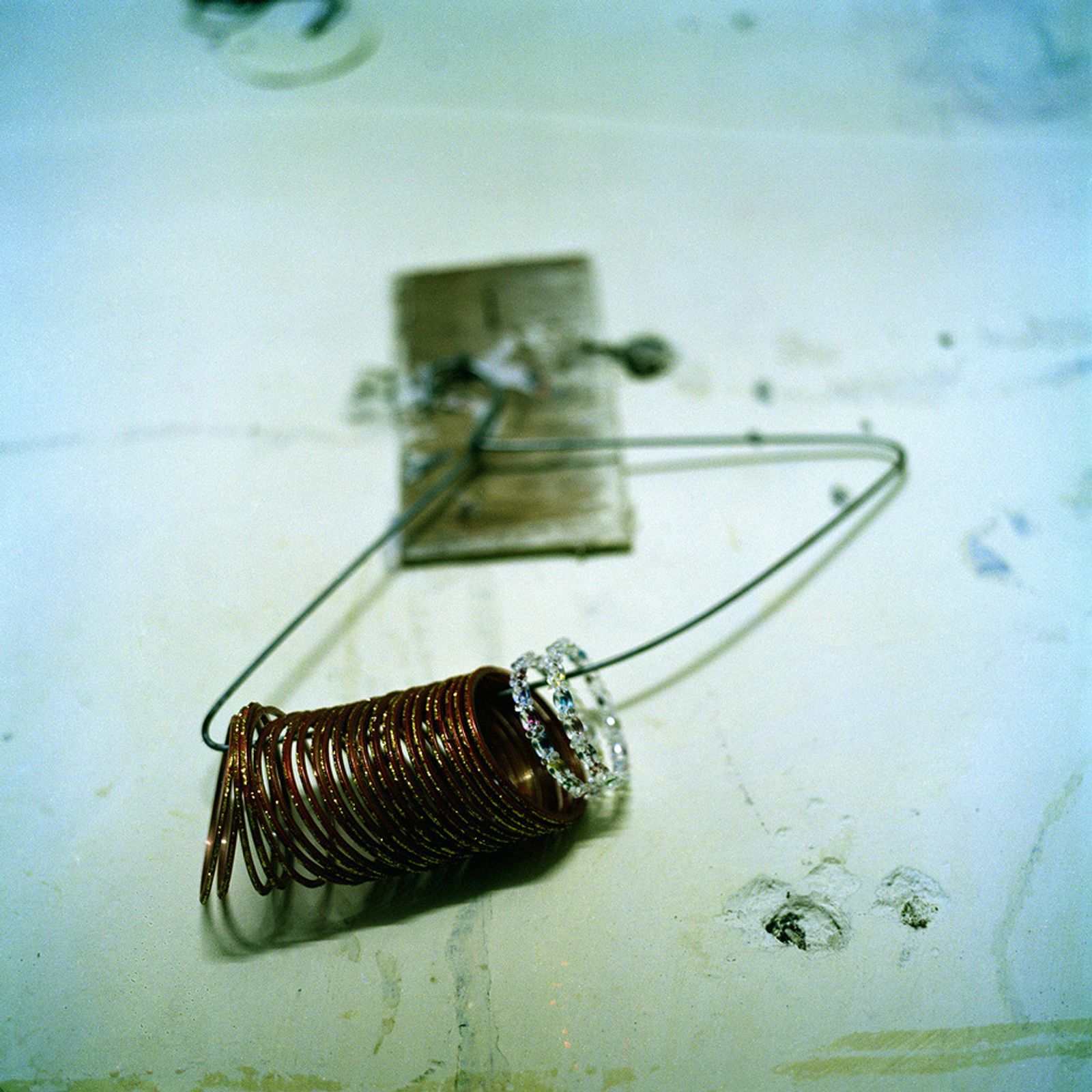 © Poulomi Basu - Bangles belonging to Shabbo Kumari hanging on the wall of her house, Punjab, October 2009