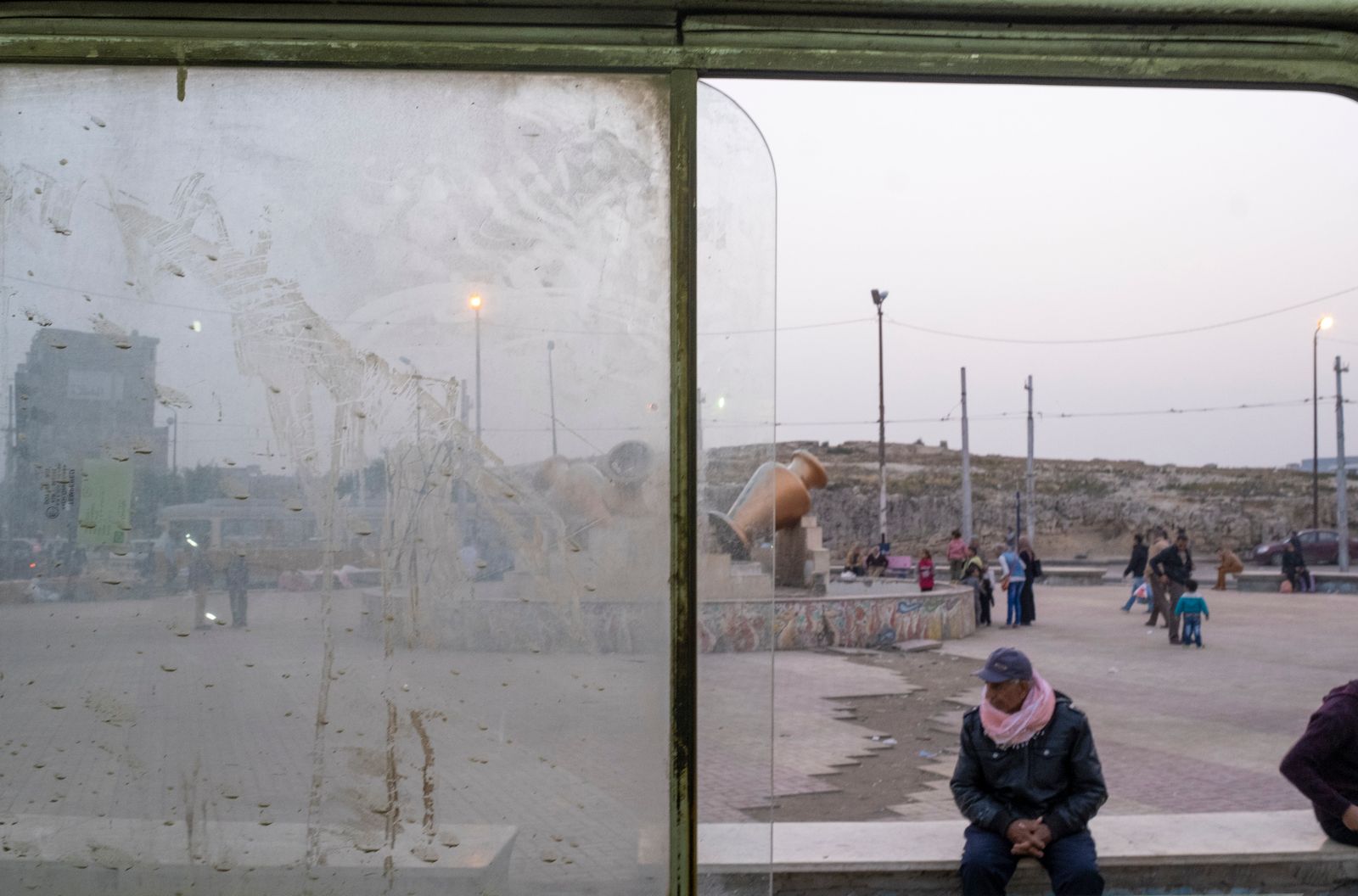 © Fatma Fahmy - View of an unidentified man as he sits outside a tram carriage in the wardien area, Alexandria, Egypt, April 6, 2019.