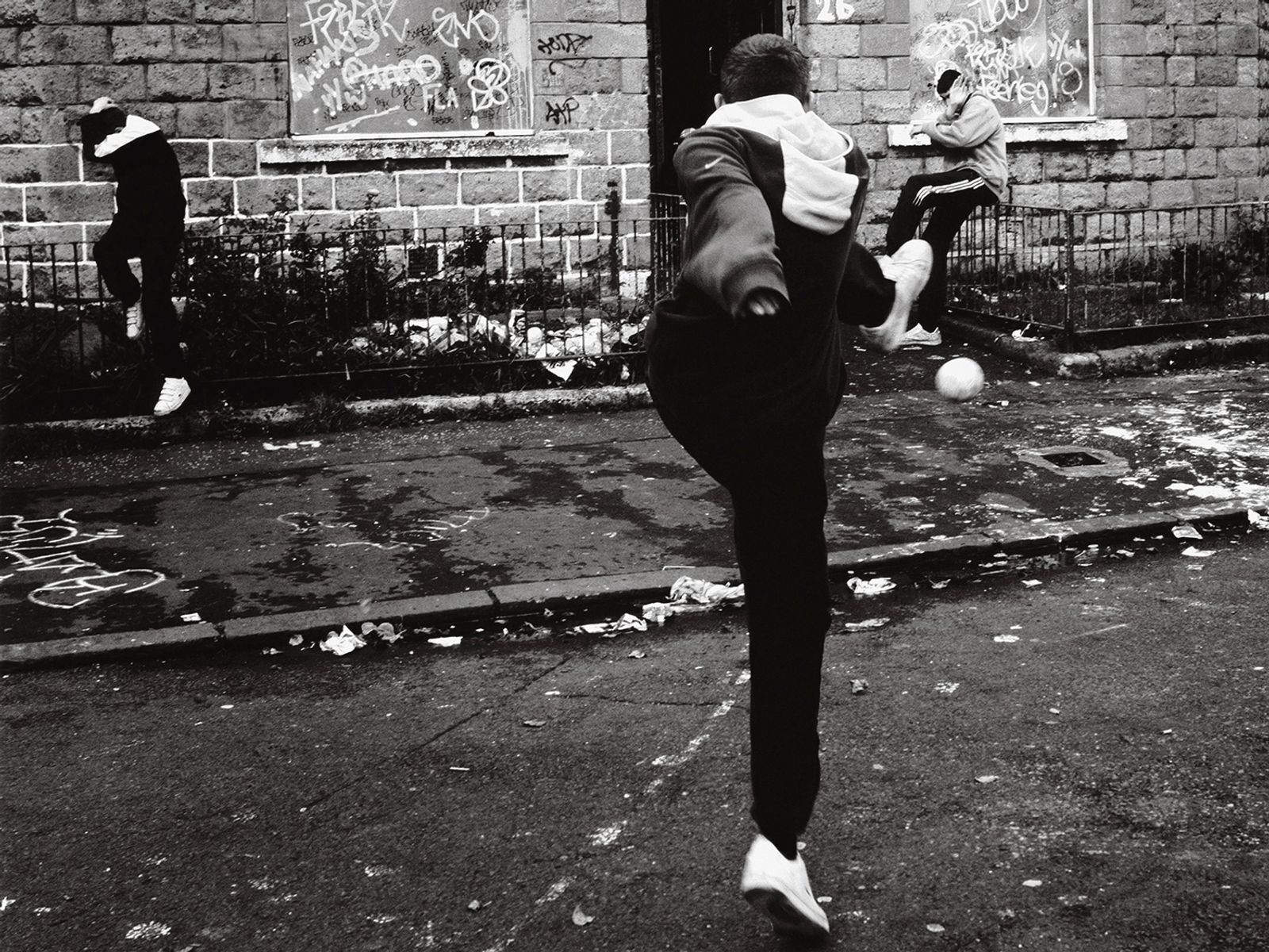 © Toby Binder - Glasgow, Ibrox. Teenagers prowling the streets with drugs and football.