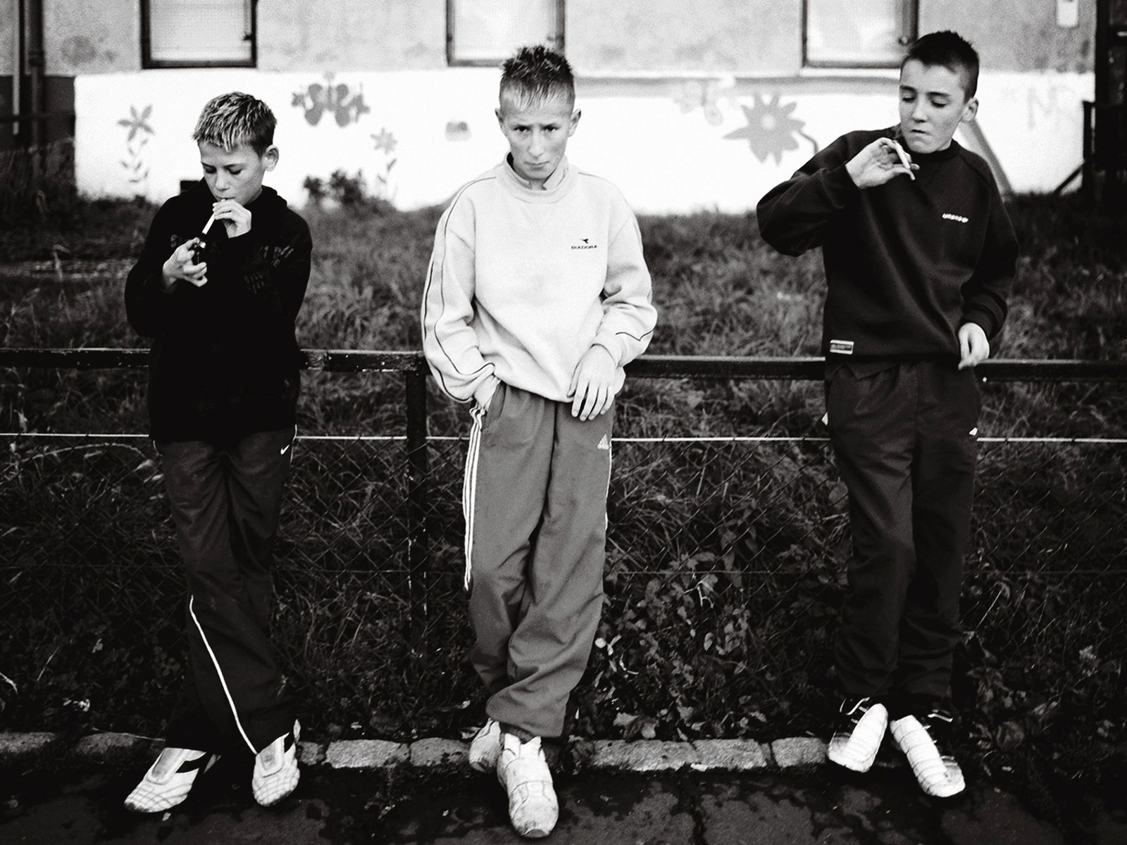 © Toby Binder - Edinburgh, Niddrie. Young boys smoking cigarettes.