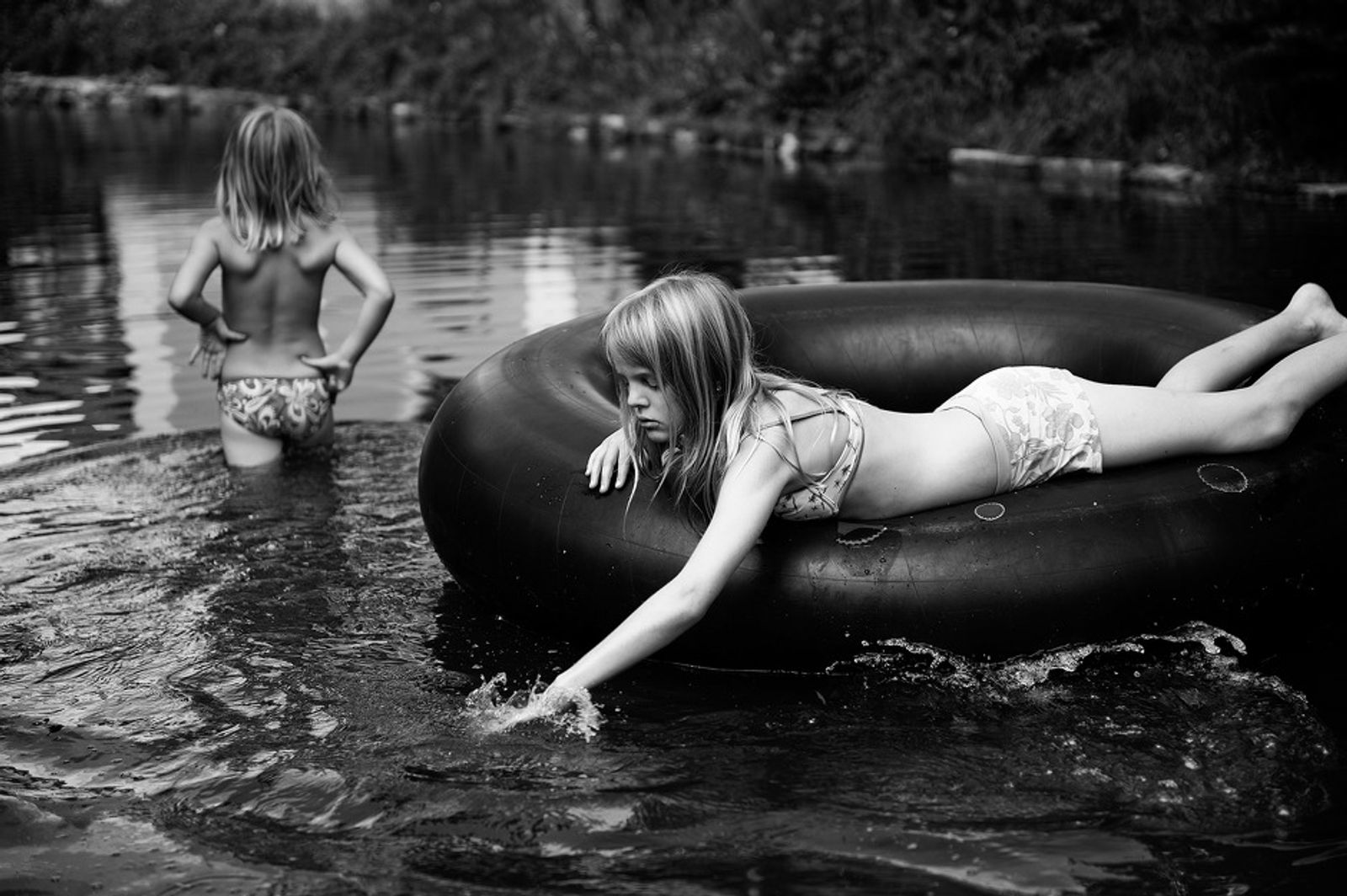 © Carla Kogelman - 2012, Hannah and Alena in the pont in front of their home