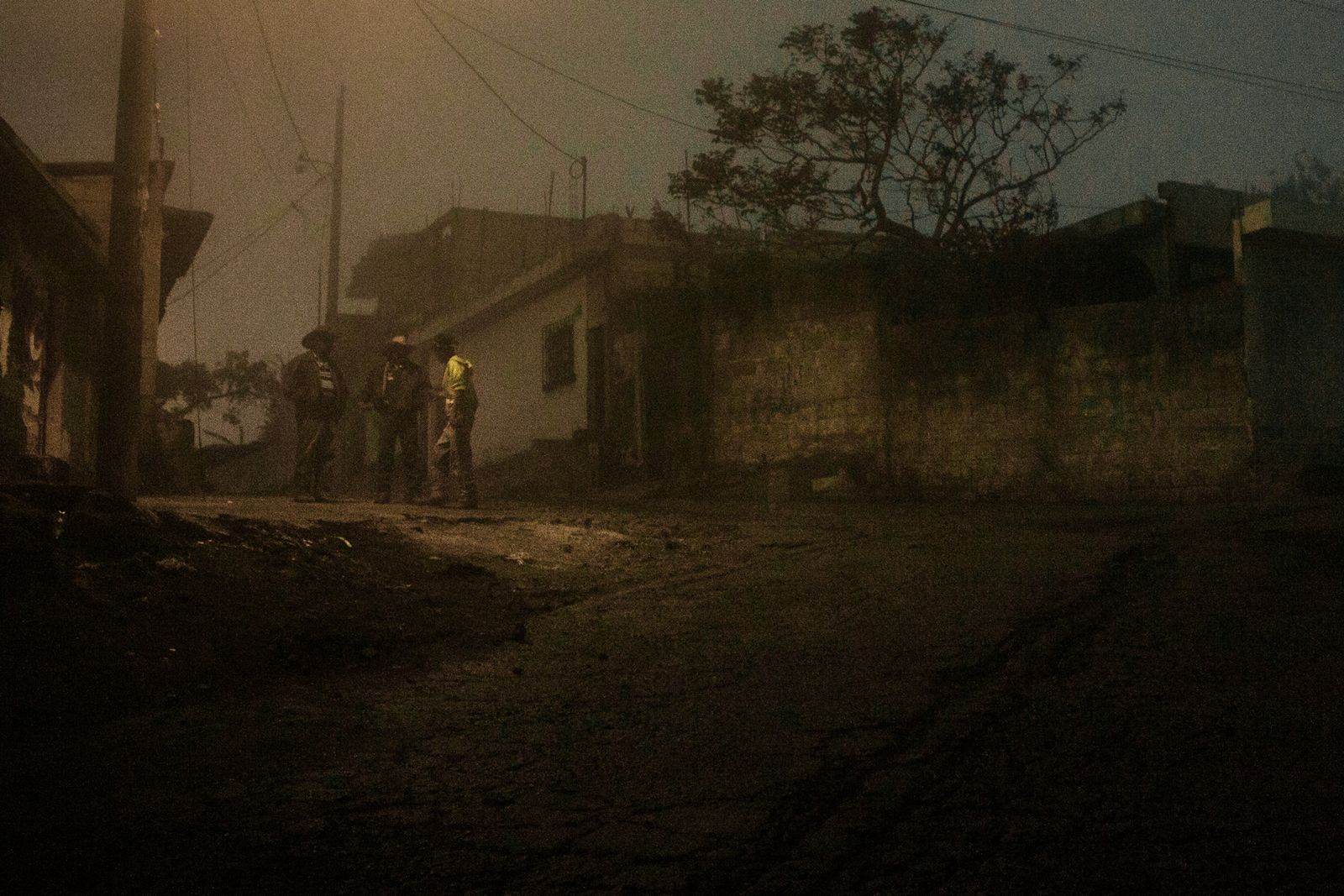 © Celine Croze - Men talking before enter to the speakeasy. Patrocinio, Guatemala, 2015.