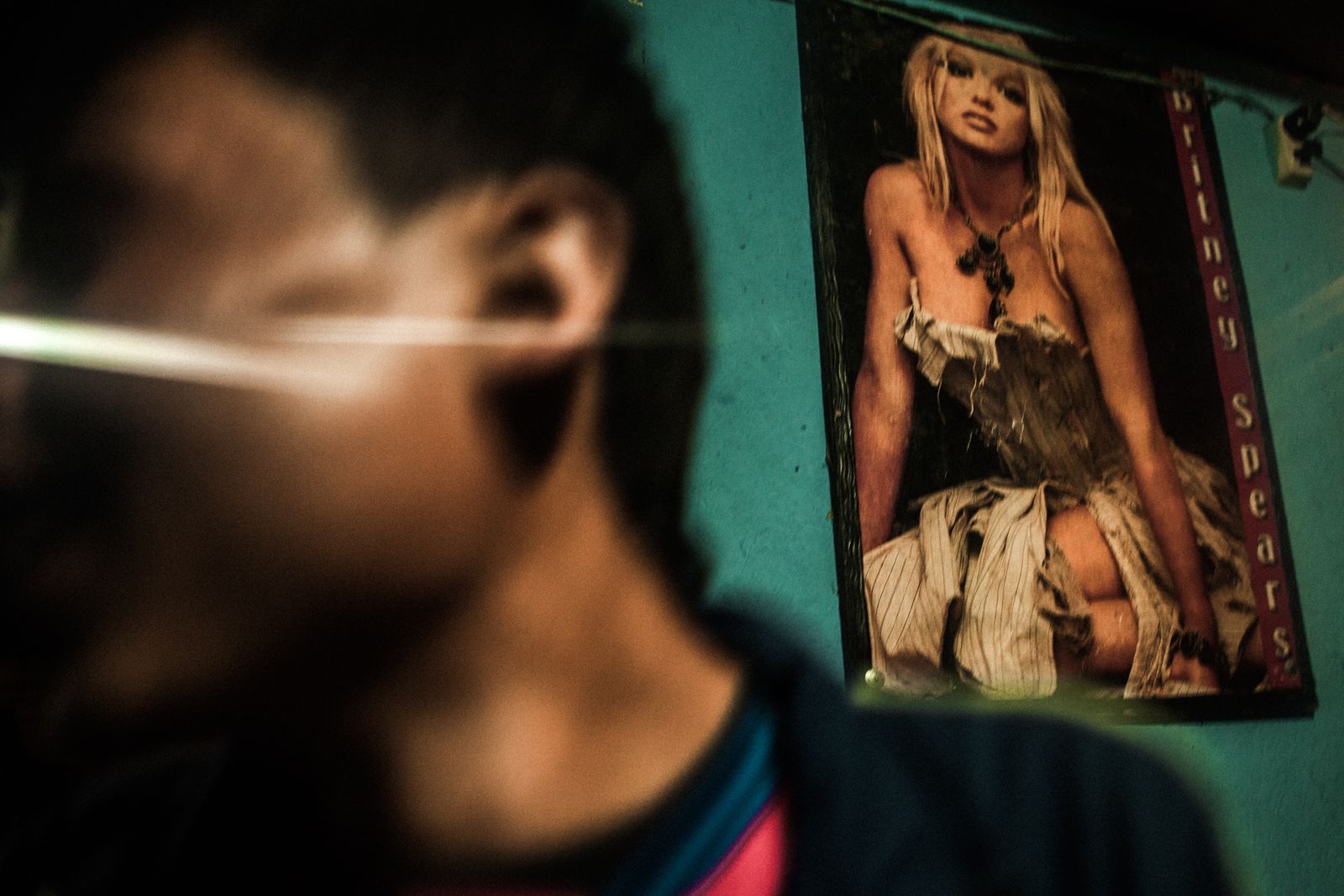 © Celine Croze - Inside the speakeasy, Pablo just caught a prostitute. Patrocinio, Guatemala, 2015.