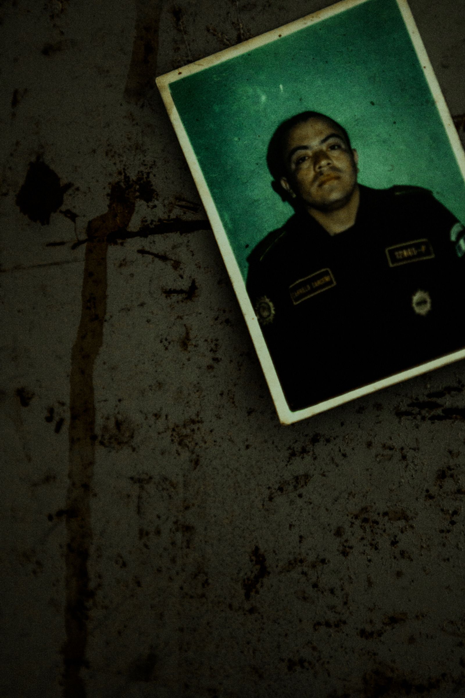 © Celine Croze - Photo of a policeman who was killed. This photo is pinned as a trophy. Patrocinio, Guatemala, 2015