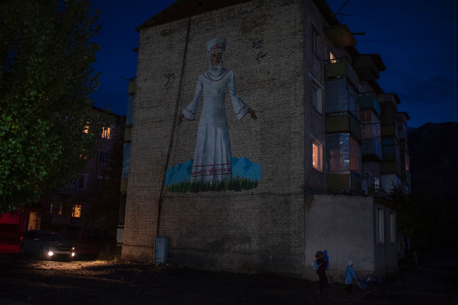 © Irina Unruh - A building with a mural of a woman in national clothes is a few meters from the family home.