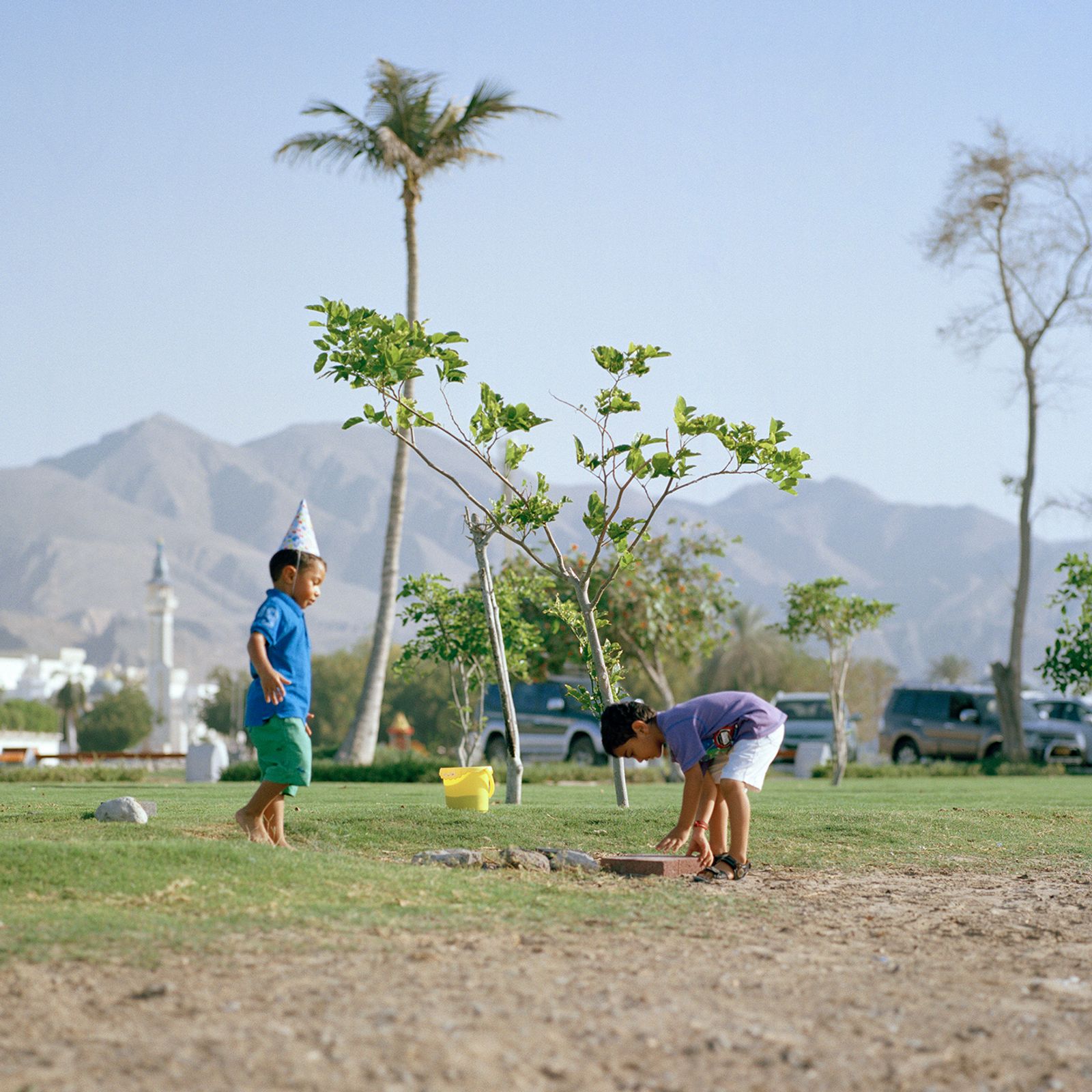 © Josh Adam Jones - Children playing on Shatti Beach. Muscat, Oman.