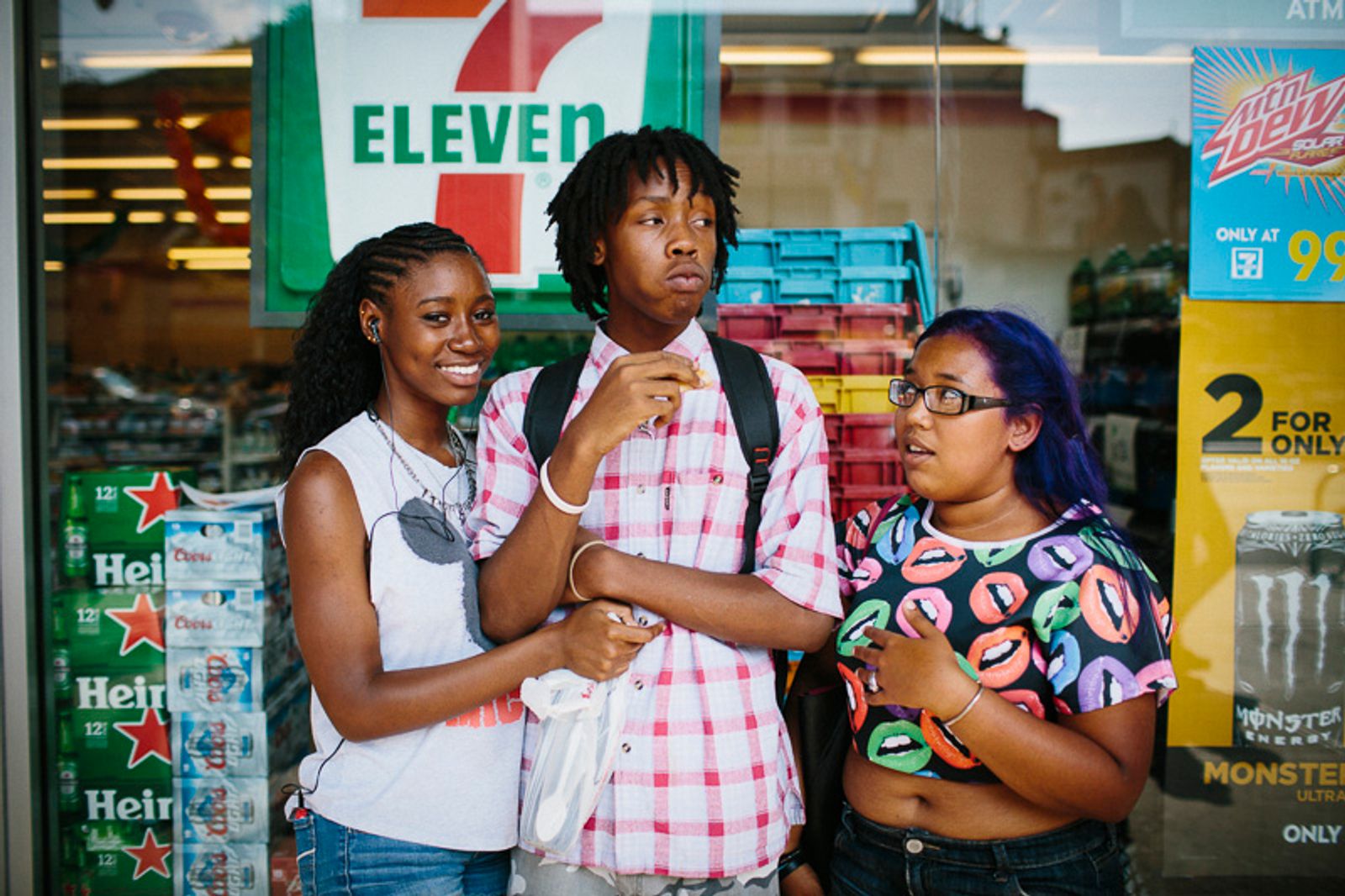 © Cassandra Giraldo - From left, Tiffany, Hannibal and Lavendar hang out near Fulton Mall in Brooklyn, New York after school on September 4, 2014.
