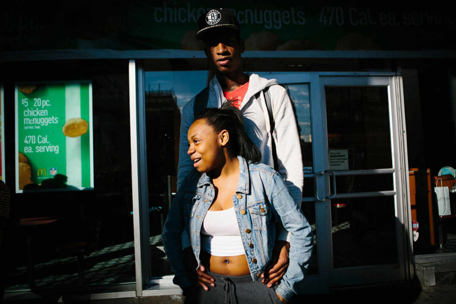 © Cassandra Giraldo - Naya and Miguel flirt after school outside of a McDonalds in Brooklyn, New York on September 17, 2015.