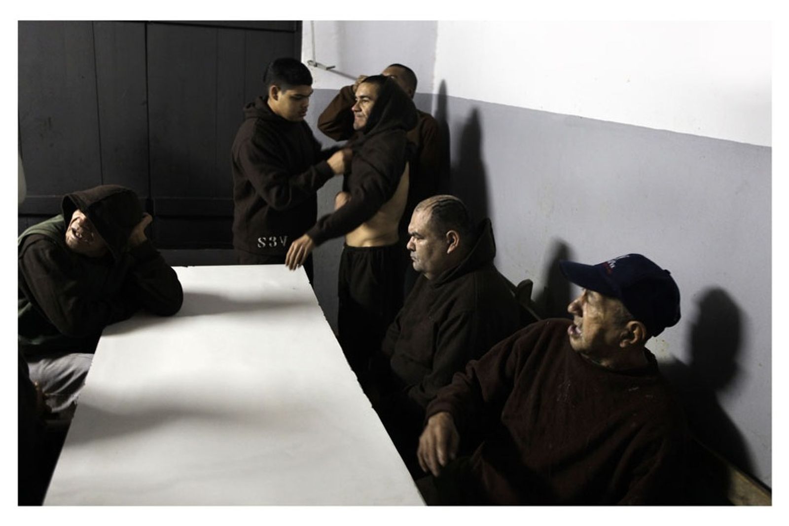 © Jorge Saenz - Patients wait the lunch at Psychiatric Hospital, Asuncion, Paraguay, May 30 , 2013.