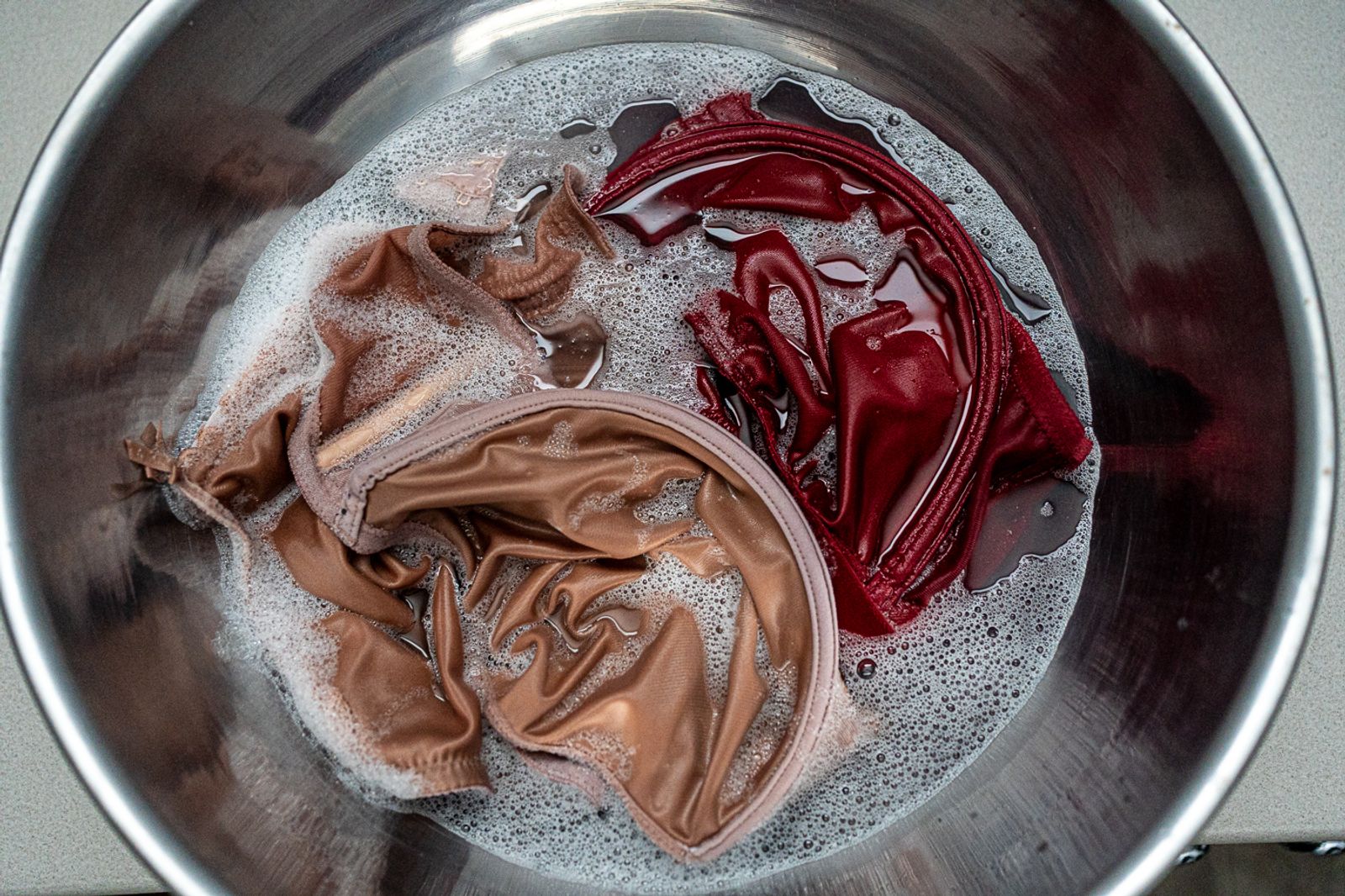 © Bobbi Barbarich - She carefully hand washes her bras so she can donate them later to women in need.