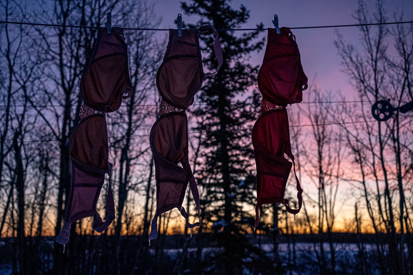 © Bobbi Barbarich - Her bras dry on the clothesline as the sun rises again.