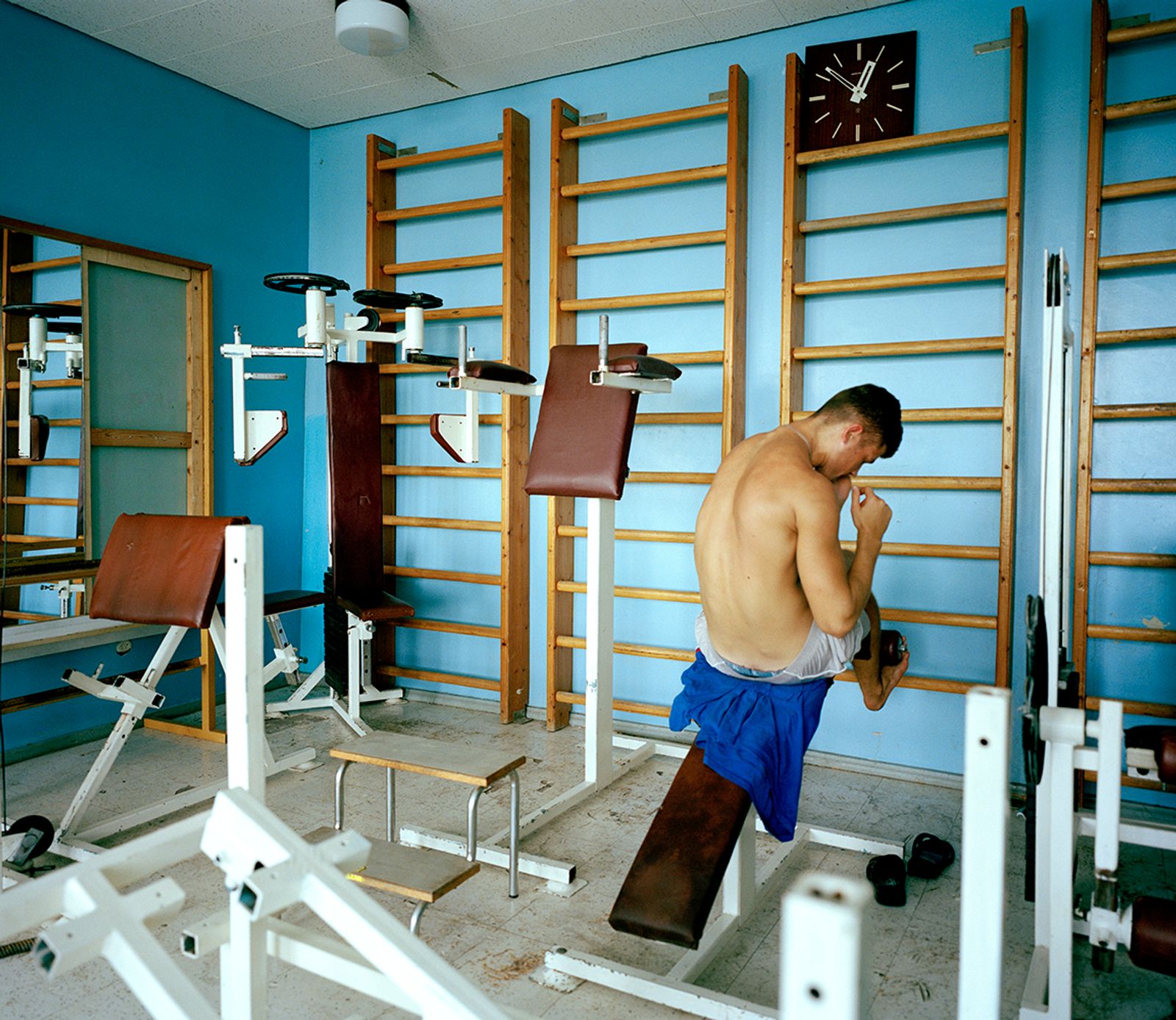 © Michal Solarski - Yevgienyi. A man at the gym at Foros sanatorium. August 2016, Crimea.