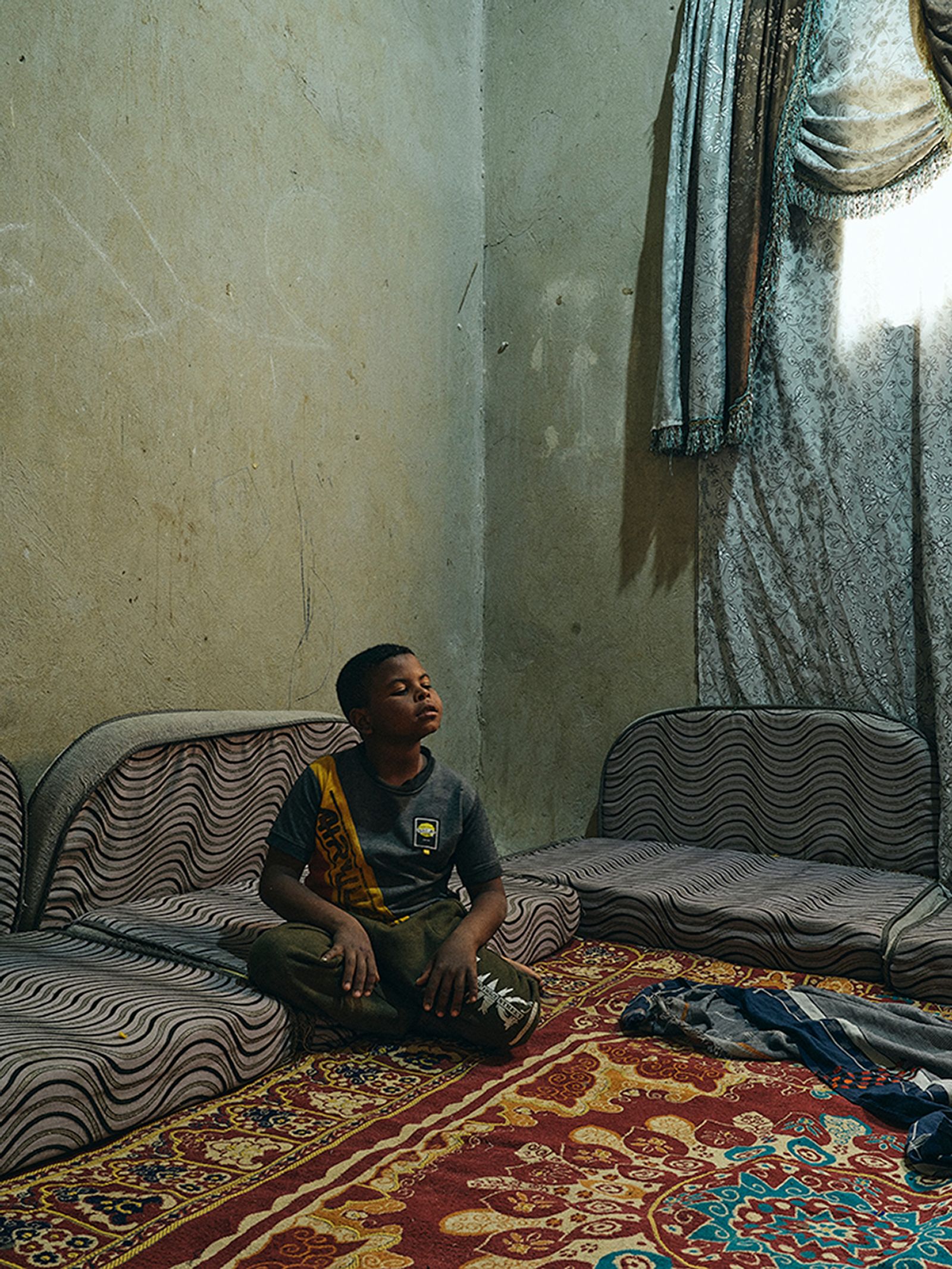 © Nathalie Mohadjer - Young boy in the livingroom