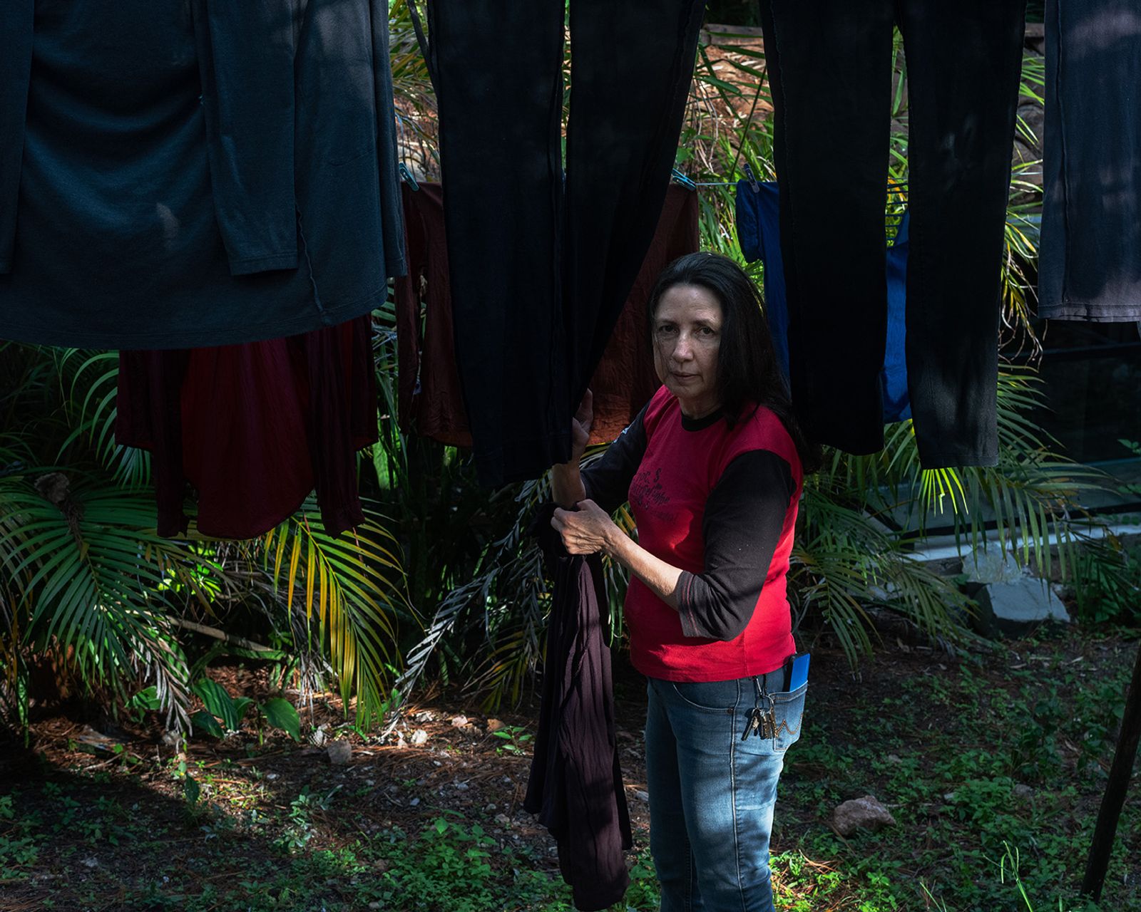 © Ariel Sosa - My mother hanging clothes to dry outside my family's home.