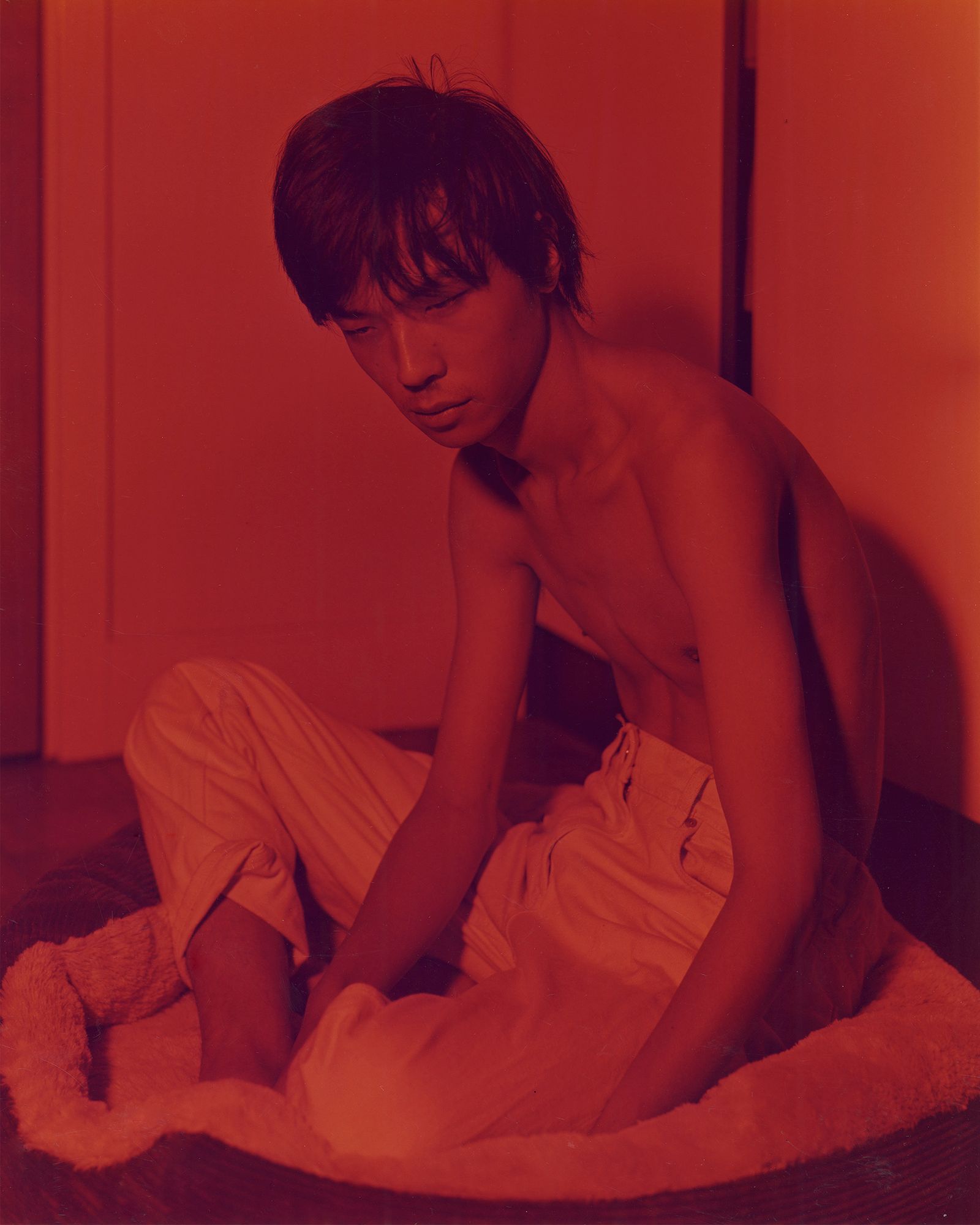 © Bowei Yang - Wong in the pet bed, color darkroom print, 2019.