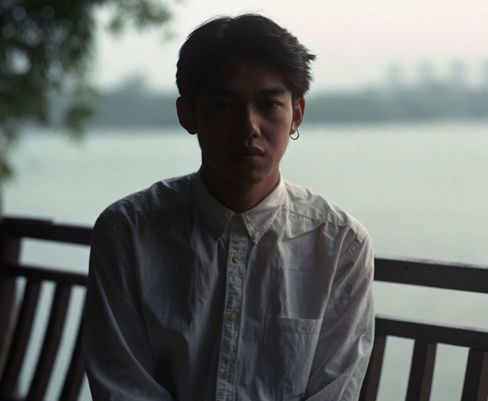 © Bowei Yang - Shen sitting by the Fuchun River, Hangzhou, China, 2016.