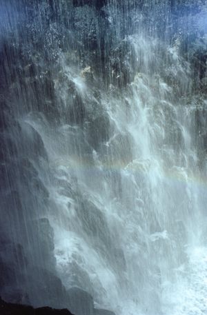 The waterfall fills the river