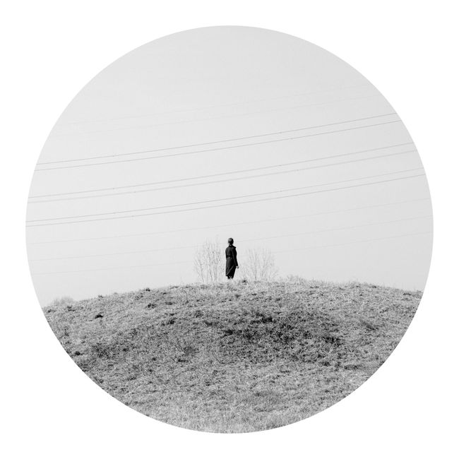 © Tianhu Yuan - Along the Wei River. It is a riverside park now. A woman is standing on a mound.
